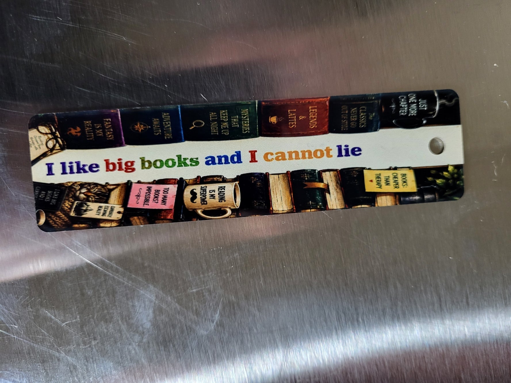 I Like Big Books and I Cannot Lie — custom printed aluminum bookmark with tassel, finished product