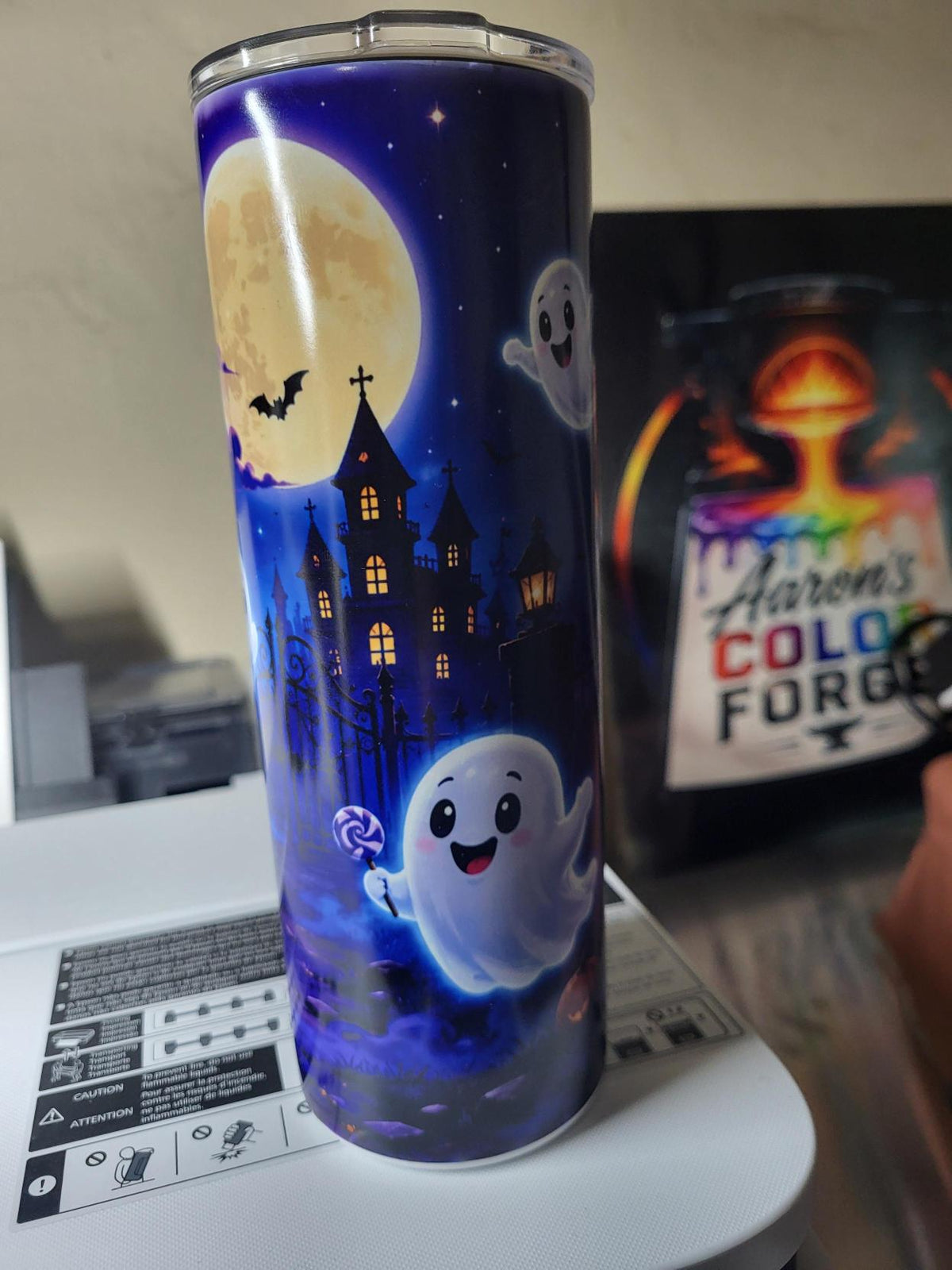 Halloween ghost tumbler side view with glowing ghosts and graveyard fence with jack-o-lanterns